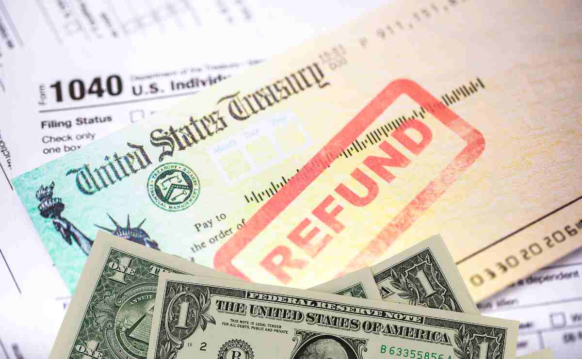 Dollars, refund check and IRS forms to talk about the fact that you can check these refunds in the United States to see if you qualify