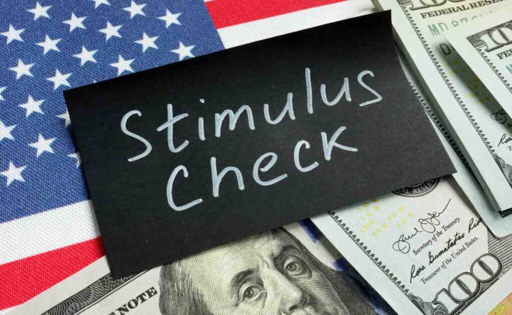 Sign with stimulus check, dollars and US flag to deal with payments of $3,284 from stimulus checks in Alaska coming soon