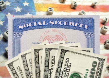 SSA card, dollars and US flag for Social Security and the new payments in November