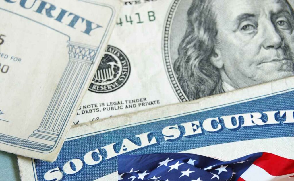 SSA card, dollars and US flag to talk about Social Security is sending checks of up to $4,555