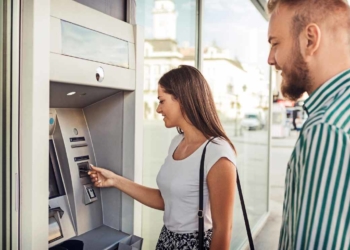 Couple at ATM Stimulus check of up to $400 for joint filers