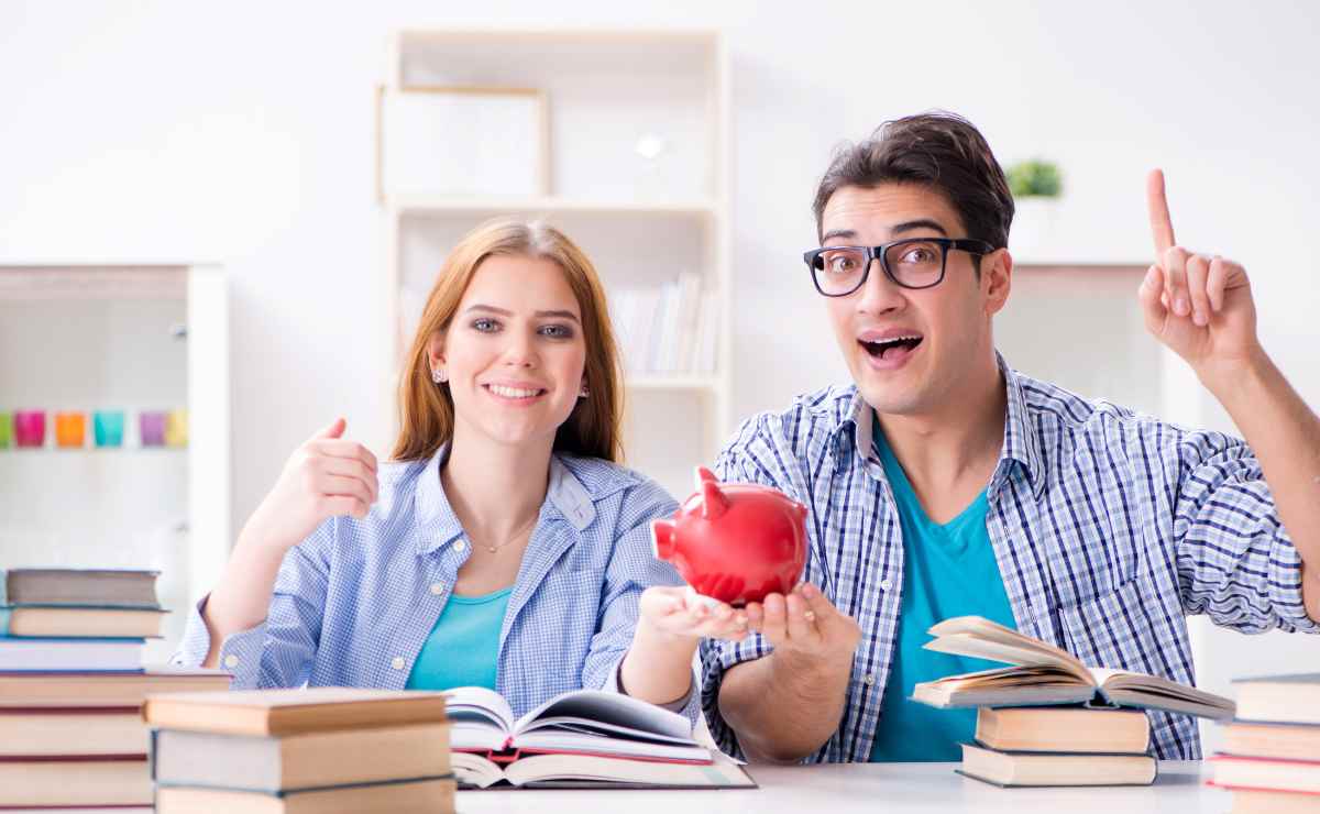 Students in the library with a piggy bank to get SNAP benefits and save money every month