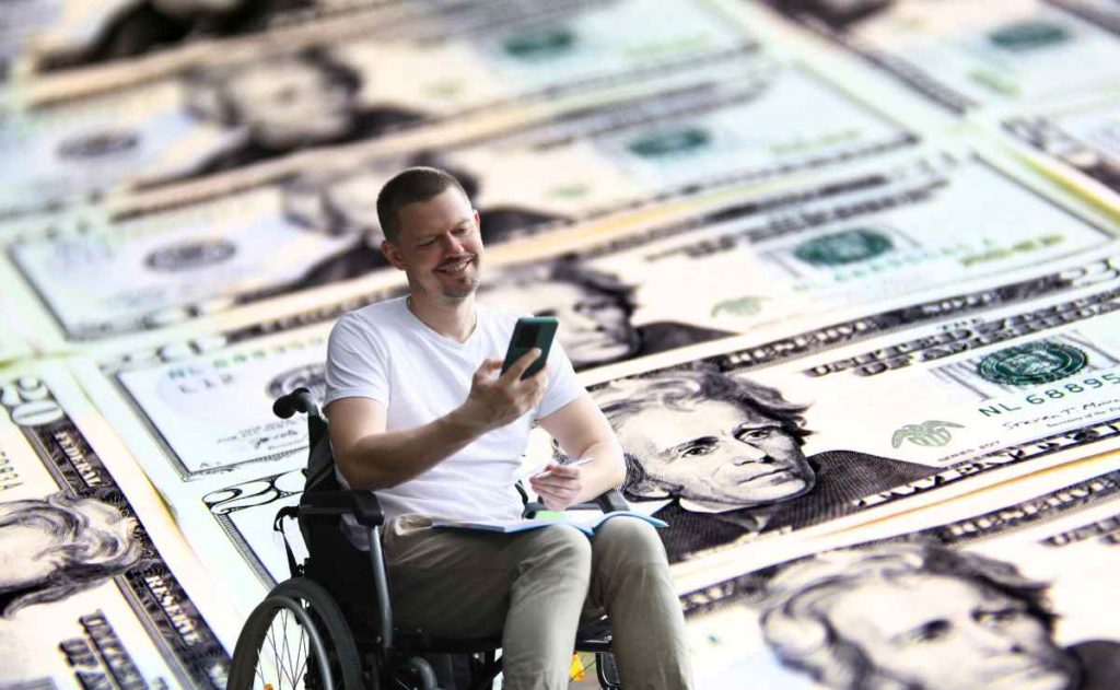 Person with a disability and dollars for SSDI and the new amounts for disability benefits