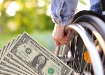 Dollars and person with a disability to talk about SSDI payments in November