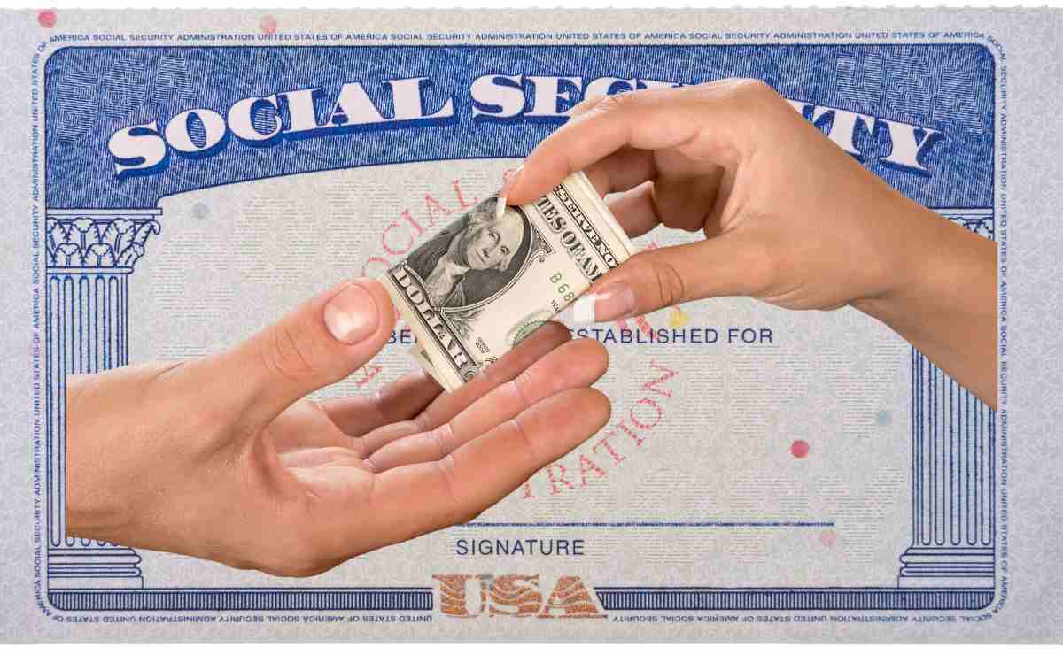 Hand giving and hand receiving dollars for Social Security and overpayment